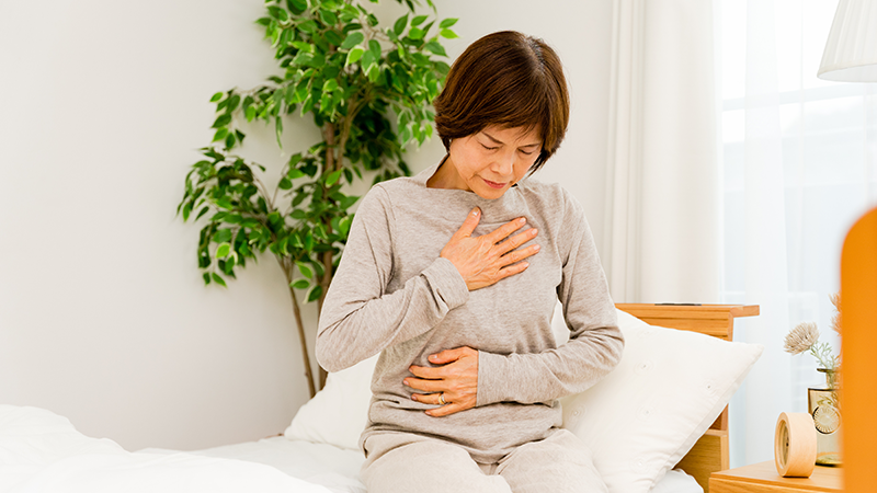 体調がすぐれない女性